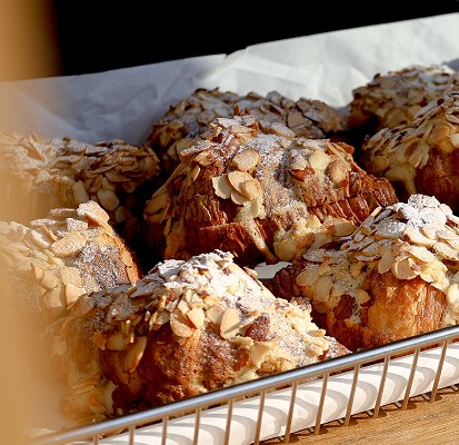 Almond croissants in a bakery basket